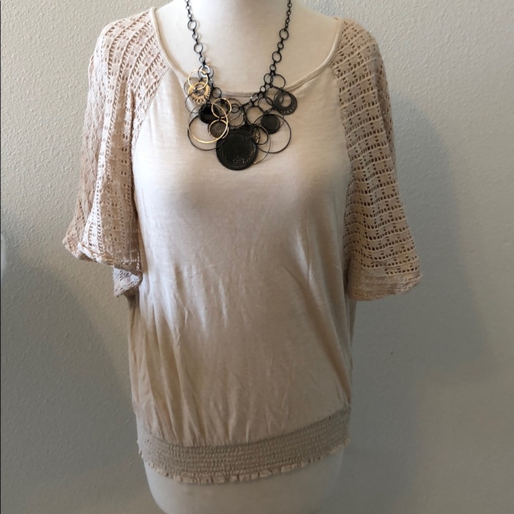 Flattering beige top with see through sleeves!